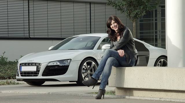 Woman with luxury car without plate